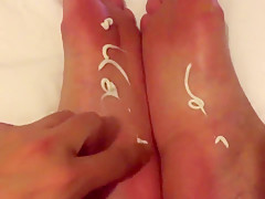 Rubbing lotion into my sexy feet...