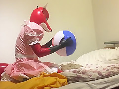 Rubber fox maid plays with beach...