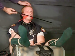 Tall redheaded kilted cop bound gagged...