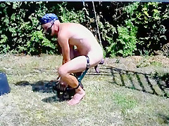 Naked hot slave outdoor swinging at...